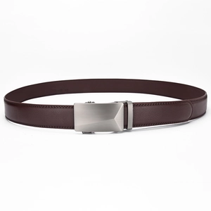 Macro shot of dark brown leather belt with lychee texture and brushed metal buckle