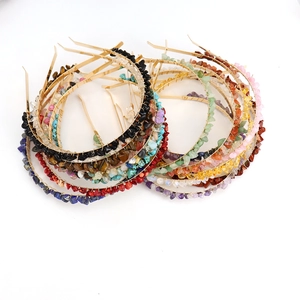 Detailed view of handmade gold wire headbands featuring colorful natural crystal stone chips