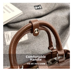 Detailed macro view of smooth dark brown leather handle with silver metal ring connector