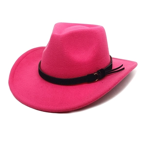 Detail of rose red felt cowboy hat featuring black tassel band and metallic buckles
