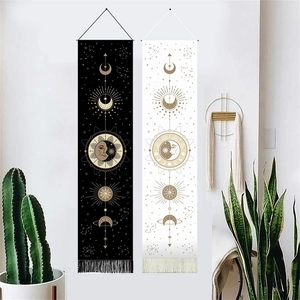 Bohemian sun and moon wall tapestries in black and white with golden celestial patterns