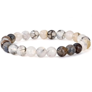 Macro detail of natural stone beads showing marble textures and unique patterns on bracelet