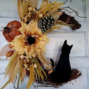 Halloween moon-shaped wicker wreath with black cat silhouette and autumn pumpkin accents