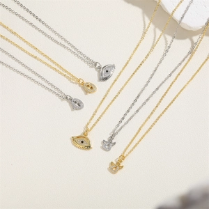 Elegant 14K gold plated evil eye and angel pendant necklaces with cubic zirconia on white