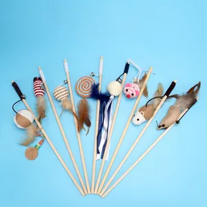 Interactive wooden cat wand set with feathers bells and mouse toys on a blue background