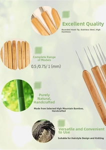 Detailed close-up of 0.5mm to 1.0mm stainless steel crochet hooks with bamboo handles
