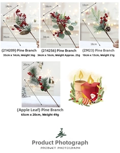 Detail view of artificial pine branches with red berries and pinecones for Christmas decor