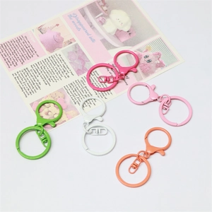 Colorful metal lobster clasp keychains for DIY crafts in green, white, pink, and orange