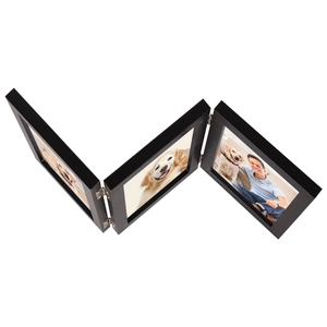 Detail view of a triple folding black wooden picture frame with silver metal hinges
