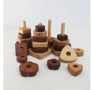 Detailed view of natural wooden stacking blocks in flower, circle, and square shapes