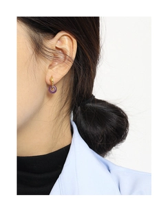 Elegant s925 silver knot earrings with purple jade ring pendants shown on a model