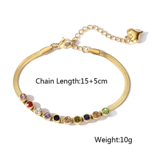 Detail of gold snake chain bracelet featuring ten colorful zircon stones and heart pendant