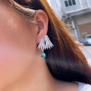 Elegant S925 silver hoop earrings with hollow multi-circle design and blue teardrop pendant