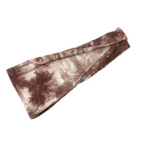 Tie-dye sports headband in coffee and beige knit fabric, diagonal view on white background