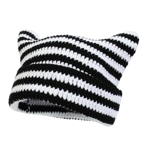 Handmade black and white striped crochet beanie with cute cat ears for winter warmth