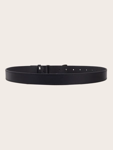 Close-up of black leather belt with minimalist mirror bow buckle and multiple adjustment holes