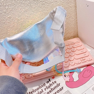 Detail view of the silver sequin waist bag back with durable plastic buckle and zipper closure