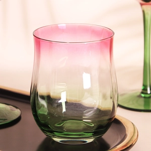 Vintage hand-blown wine glass with pink and green gradient and textured ribbing