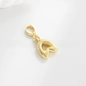 Detailed view of polished 18k gold plated balloon heart charm with a lobster clasp