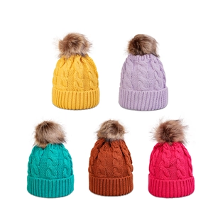 Winter cable knit pom-pom beanies in colorful shades for men and women
