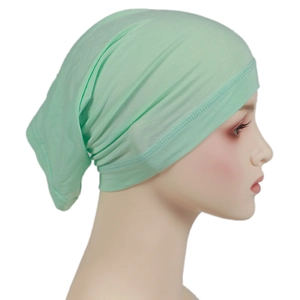 Detailed close-up of light green modal hijab cap showing soft jersey fabric texture