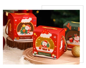 Festive red and green Christmas gift boxes with handles on white faux fur and wood tray