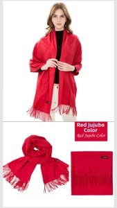 Close-up of jujube red cashmere scarf showing soft brushed texture and tassel fringes