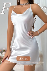 Close-up of white satin slip dress with elegant cowl neck and thin spaghetti straps