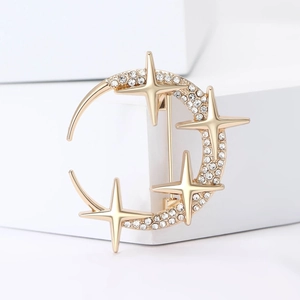Creative crescent moon and star brooch with sparkling crystals in gold metal finish