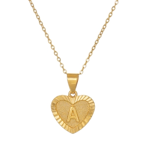 Golden heart pendant necklace with engraved letter A and radiant textured edges on O-chain