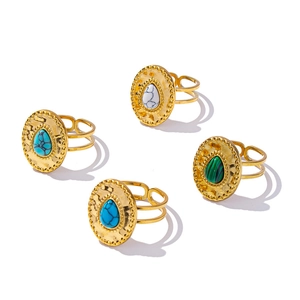 Classic gold stainless steel rings featuring teardrop gemstones in blue white and green