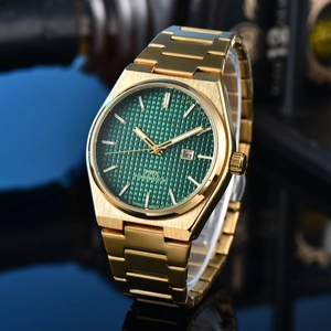 Detail of green waffle dial watch with gold stainless steel casing and date window
