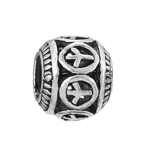 Detailed macro view of a vintage silver-plated spacer bead with embossed circular patterns