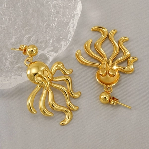 Retro 18K gold plated octopus earrings made of stainless steel on aesthetic background