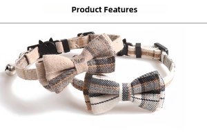 Detail of plaid pet collars with large bowknots and silver bells on white background