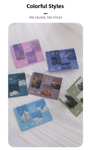 Detail view of magnetic bookmarks featuring dreamy landscape scenery and cloud patterns