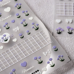 3D floral nail stickers with purple tulips, white hearts and ribbons on PET film