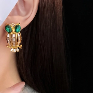 Vintage owl stud earrings in gold alloy with green gemstones and white rhinestones