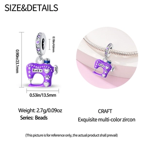 Detail showing a purple enamel sewing machine charm with cubic zirconia and BABY engraving