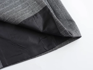 Macro detail of high-quality pinstripe wool blend fabric and seamless black inner lining