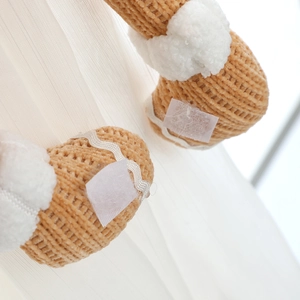 Gingerbread couple Christmas curtain tieback with knit texture and plush details
