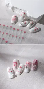 Détail d'autocollants 3D pour ongles avec motifs de roses et décorations de perles