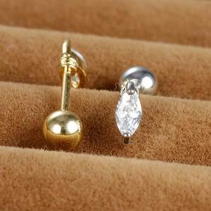 Macro shot of marquise cut zircon ear studs with secure screw-back ball design