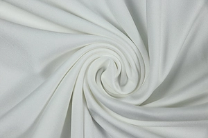 Vue macro montrant la texture fine et le motif en maille blanche du tissu