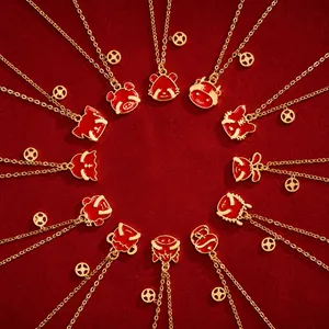 Radial layout of 12 zodiac necklaces with red enamel pendants and golden chains