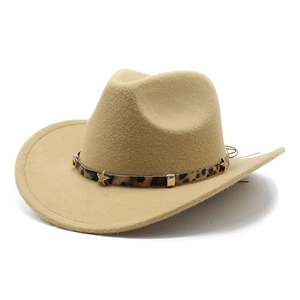 Detail of camel cowboy hat featuring leopard print band with gold star rivets