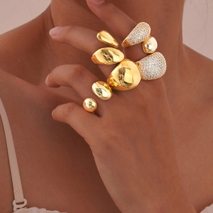 Polished gold organic lava rings set with sparkling clear cubic zirconia accents
