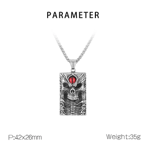Detailed view of Gothic skull pendant with red evil eye and vintage silver finish