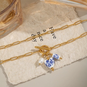 Blue and white porcelain flower necklace with pearl and paperclip chain toggle clasp