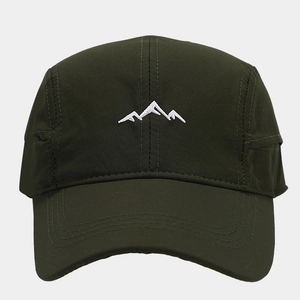 Detail of mountain embroidery on dark green quick-dry hiking cap with parallel stitches
